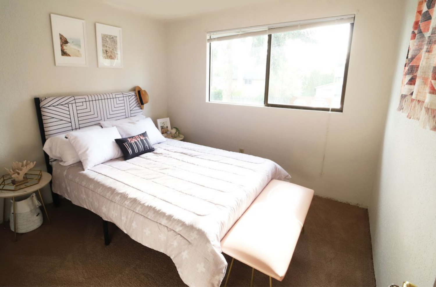 A bed with an upholstered headboard