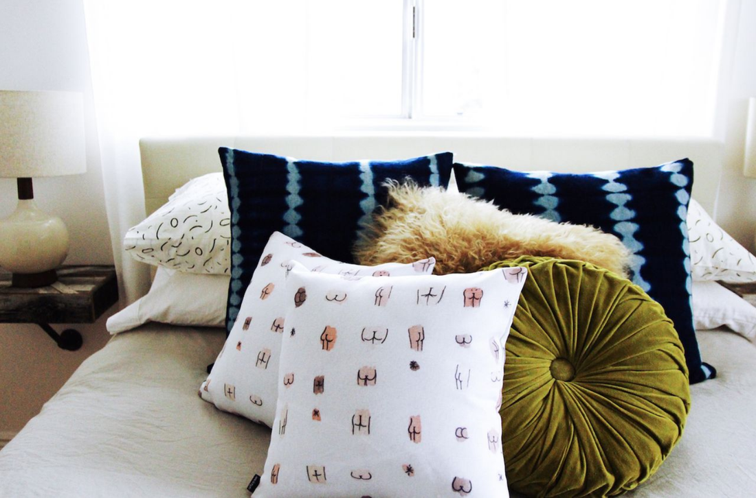 Decorated throw pillows on a bed