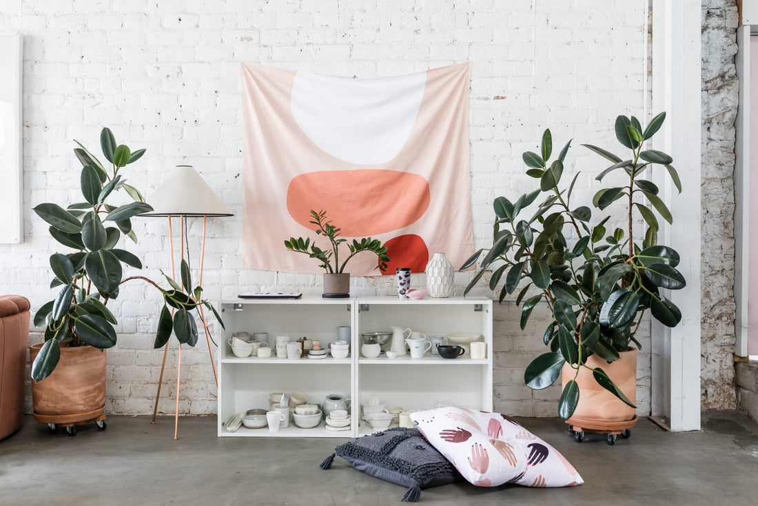 wall tapestry above mini cabinet