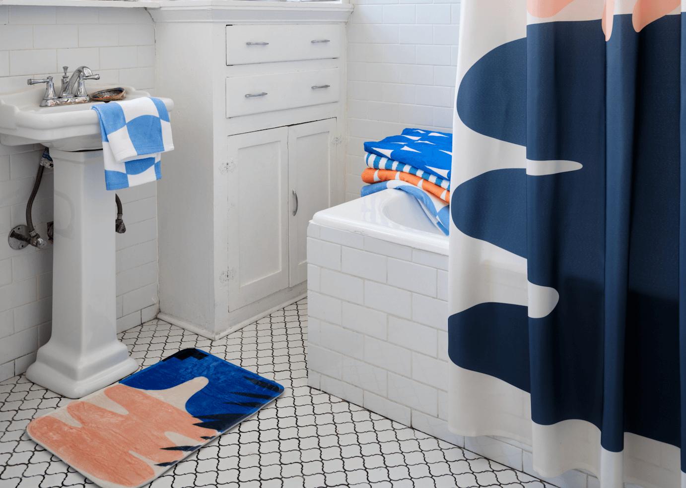 bathroom with a fun bath mat
