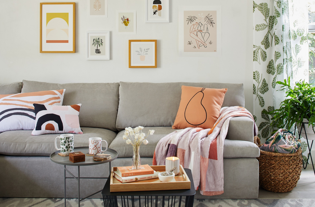 A living room with a styled rug