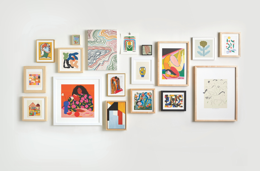 Framed prints displayed on a wall