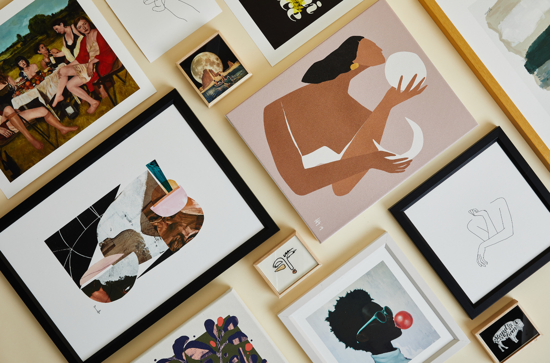 Canvas and framed prints on a wall