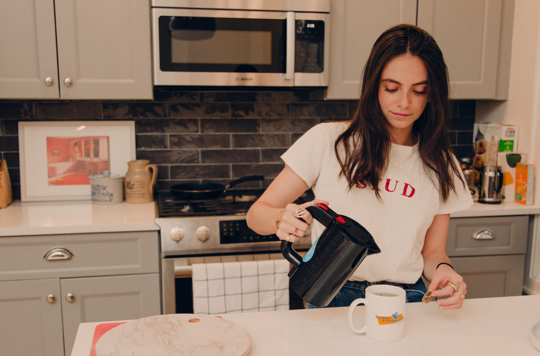 Emma Holland pouring a cup of coffee