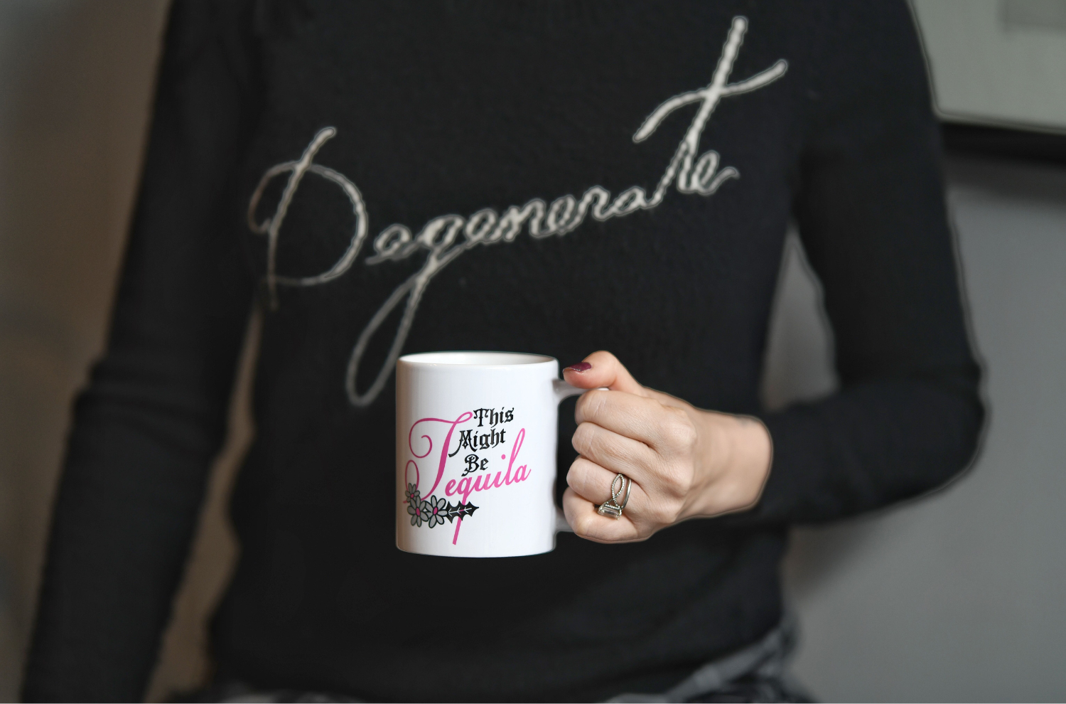 A decorated mug held by Jill Kargman