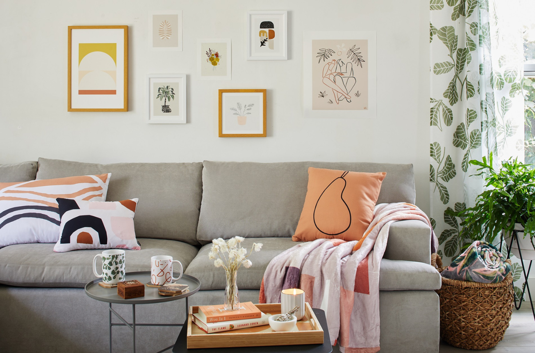 A styled throw blanket draped over a couch