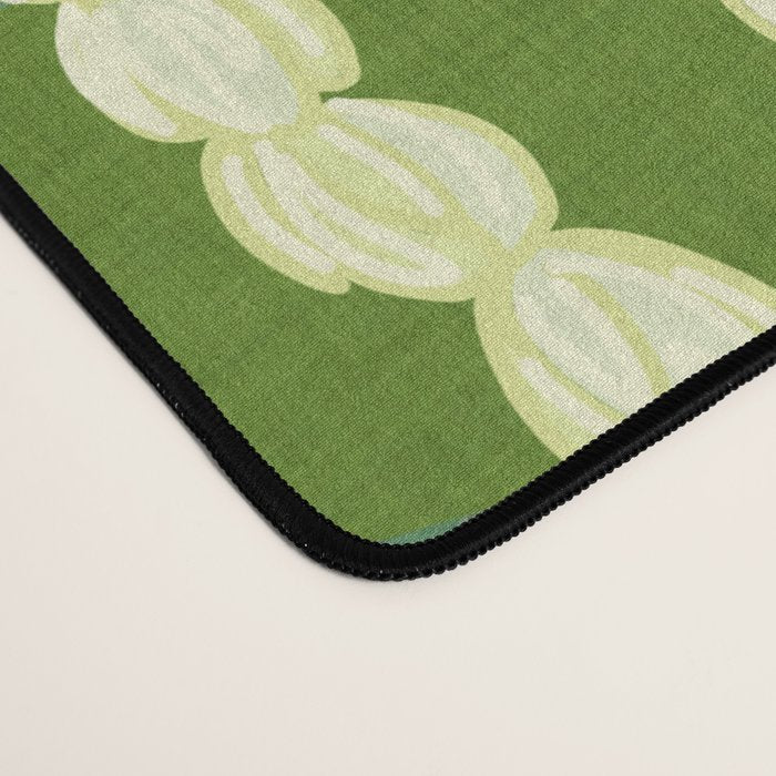Pikake Lei strands over textured banana leaves Desk Mat Gallery Image 4