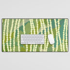 Pikake Lei strands over textured banana leaves Desk Mat Gallery Image 1