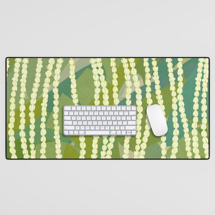 Pikake Lei strands over textured banana leaves Desk Mat Gallery Image 1