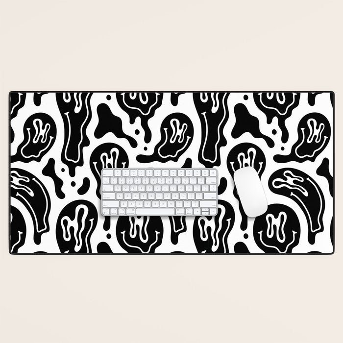 Black and white melted happy face pattern Desk Mat Gallery Image 1