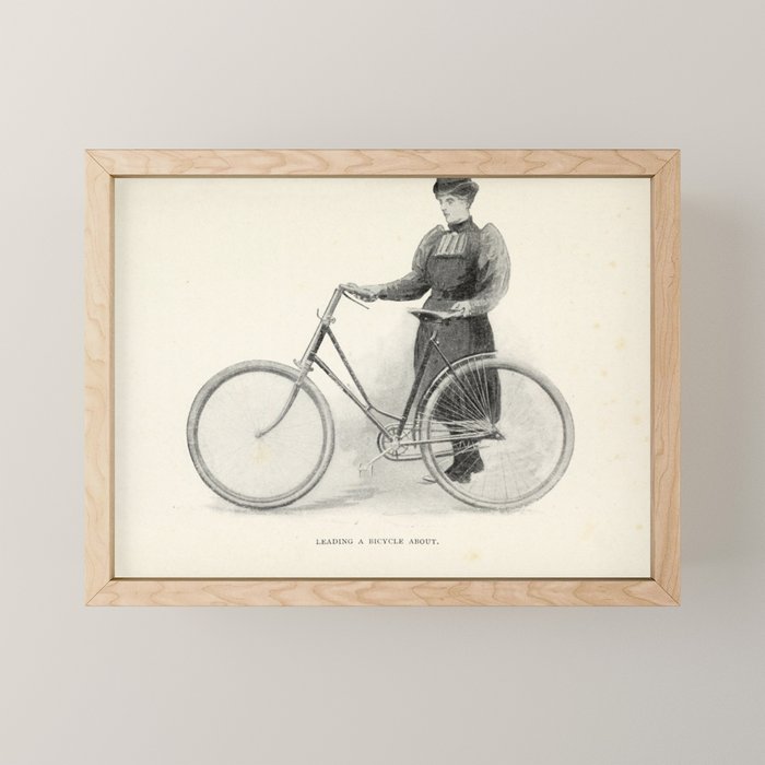 "Leading a Bicycle About" from "Bicycling for Ladies" by Maria E. Ward, 1896 Mini Art Print Gallery Image 1
