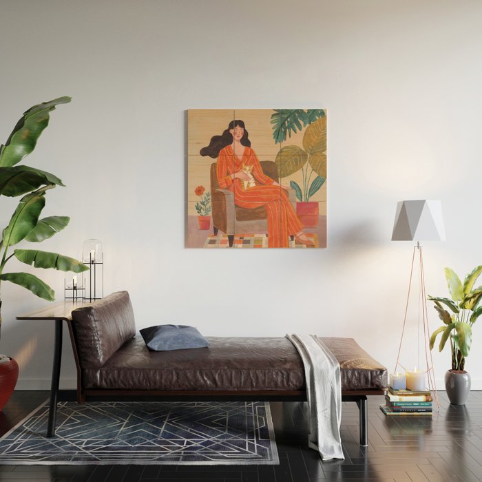 Woman with cat in living room in warm earth tones Wood Wall Art Gallery Image 2