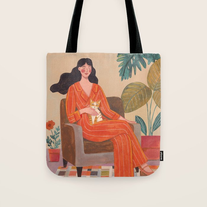 Woman with cat in living room in warm earth tones Tote Bag Gallery Image 1