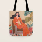 Woman with cat in living room in warm earth tones Tote Bag Gallery Image 1