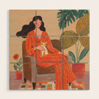 Woman with cat in living room in warm earth tones Wood Wall Art Gallery Image 1