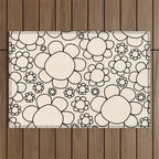 Cheerful Doodle Flowers Pattern in Black and Almond Cream Outdoor Rug Gallery Image 1