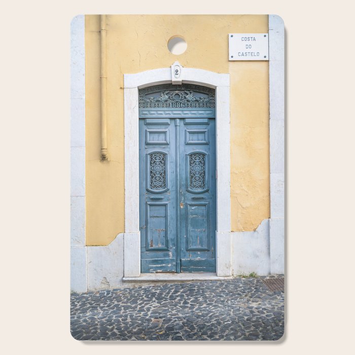 The blue door number 2 in Lisbon Portugal  Summer street and travel photography Cutting Board Gallery Image 1