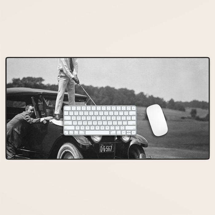 Golfer Teeing Off on Top of Car, Black and White, Old Photo, Vintage Golf Art Desk Mat Gallery Image 1