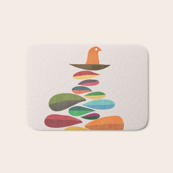 Bird nesting on top of pebbles hill Bath Mat Gallery Image 1