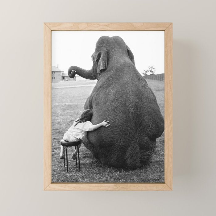 Odd Best Friends, Sweet Little Girl hugging elephant black and white photograph Mini Art Print Gallery Image 1