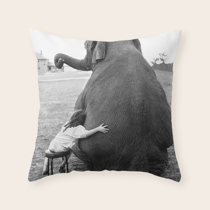 Odd Best Friends, Sweet Little Girl hugging elephant black and white photograph Throw Pillow Gallery Image 1