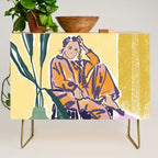 Woman wearing yellow pajamas Credenza Gallery Image 1