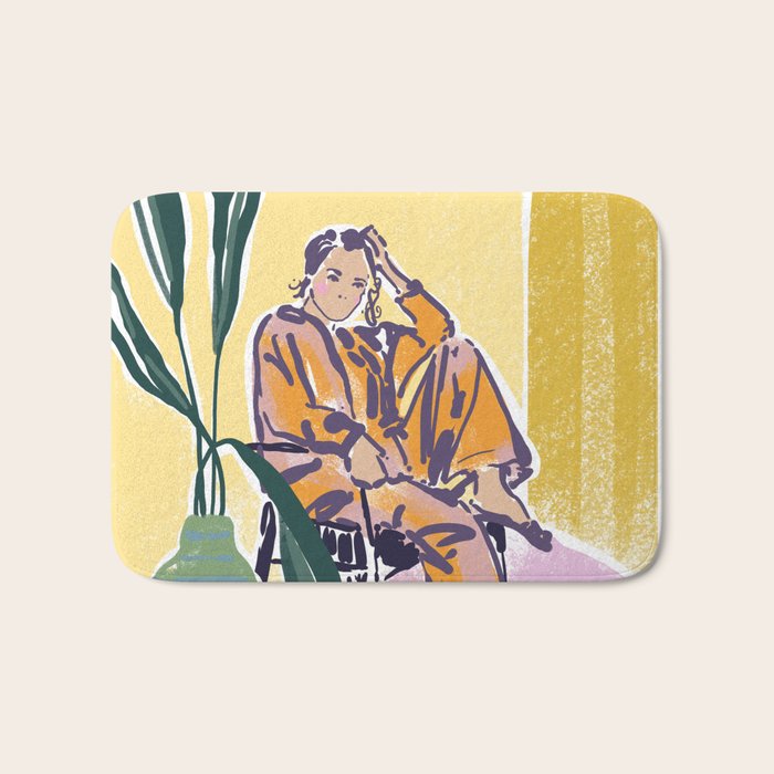 Woman wearing yellow pajamas Bath Mat Gallery Image 1