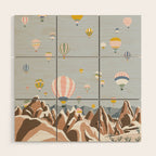 Hot air balloons over snowy mountains Wood Wall Art Gallery Image 1