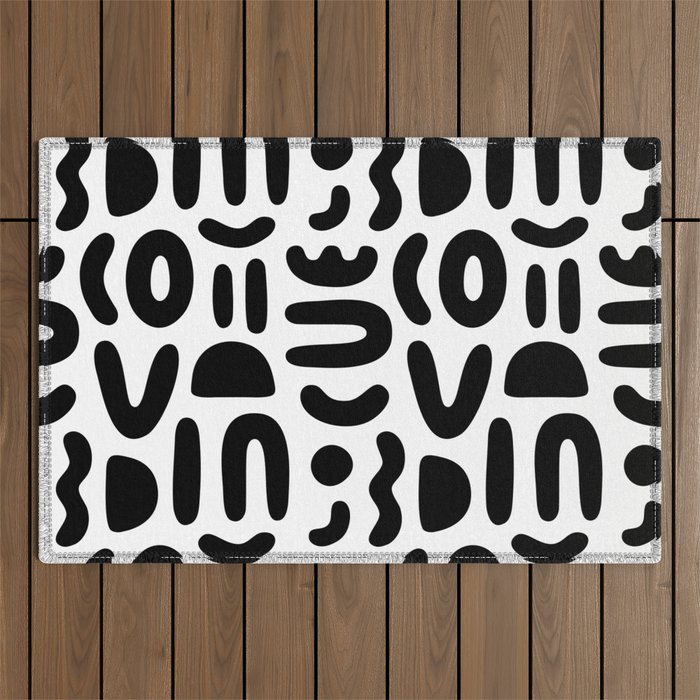 Abstract black and white symbol art pattern Outdoor Rug Gallery Image 1