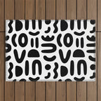 Abstract black and white symbol art pattern Outdoor Rug Gallery Image 1