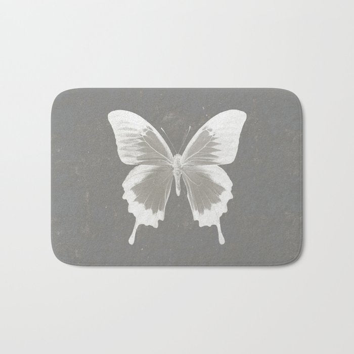 Butterfly on grunge surface Bath Mat Gallery Image 1