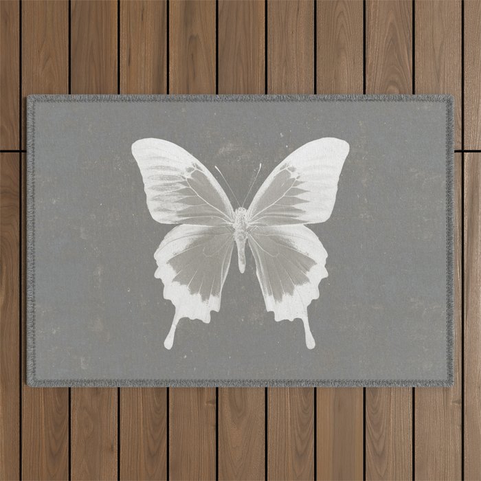Butterfly on grunge surface Outdoor Rug Gallery Image 1