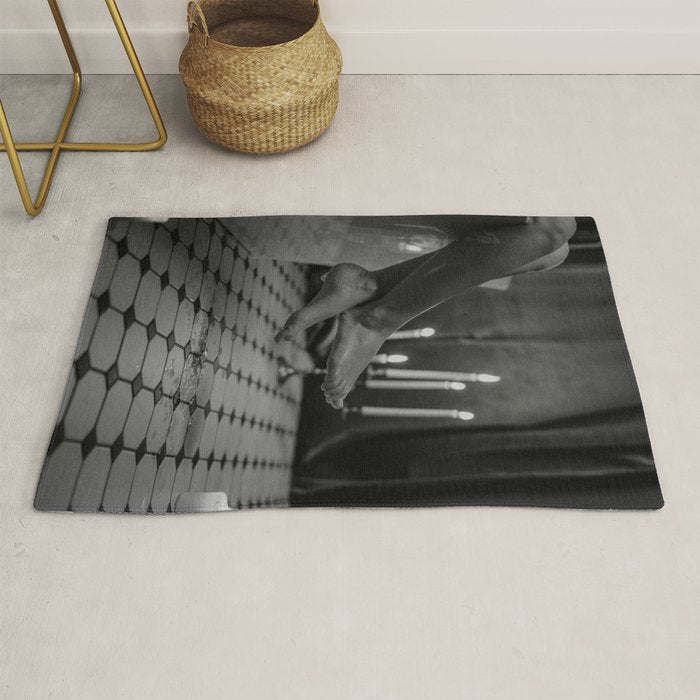 Let it all hang out; female portrait with candles in the bathtub black and white photograph - photography - photographs Rug Gallery Image 1