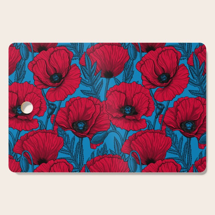 Red poppy garden on blue Cutting Board Gallery Image 1