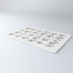 Dinosaur alphabet in muted shades of blue, grey and green Rug Gallery Image 3