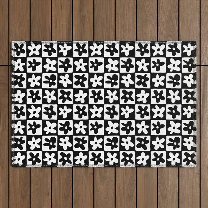 Black and white checkered floral pattern art Outdoor Rug Gallery Image 1