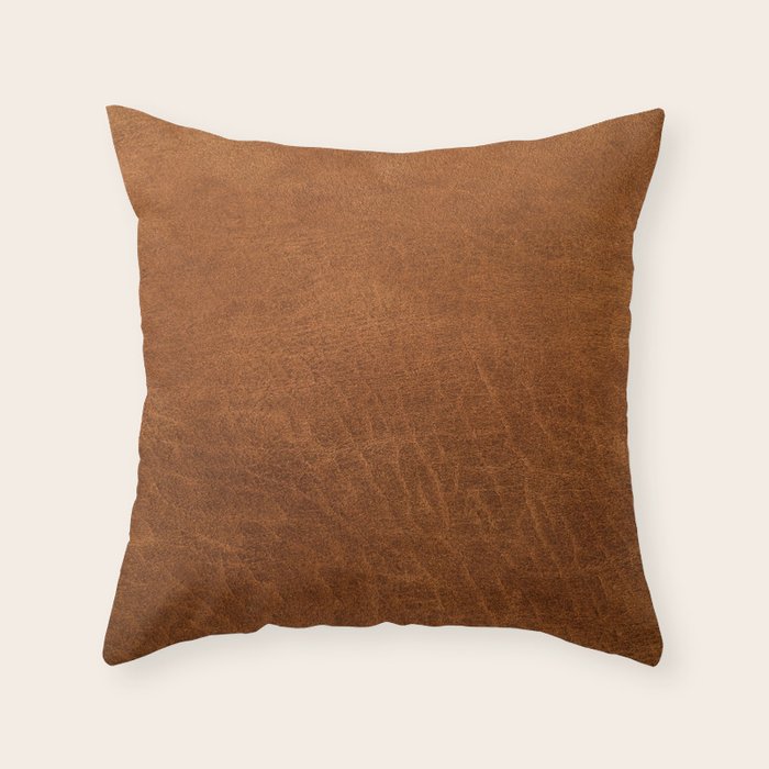medium cognac conditioned leather ( faux  ) Throw Pillow Gallery Image 1