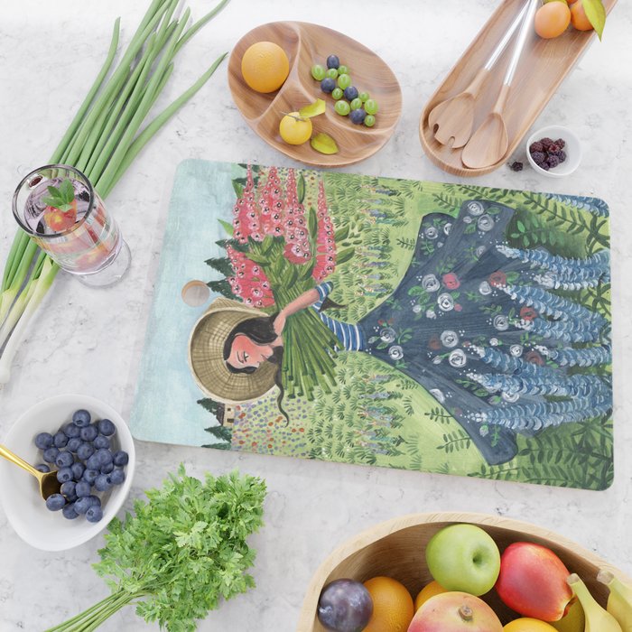 Woman Picking Flowers in the Field Cutting Board Gallery Image 2