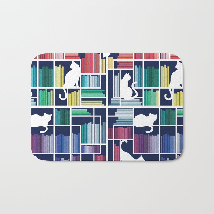 Rainbow bookshelf // navy blue background white shelf and library cats Bath Mat Gallery Image 1