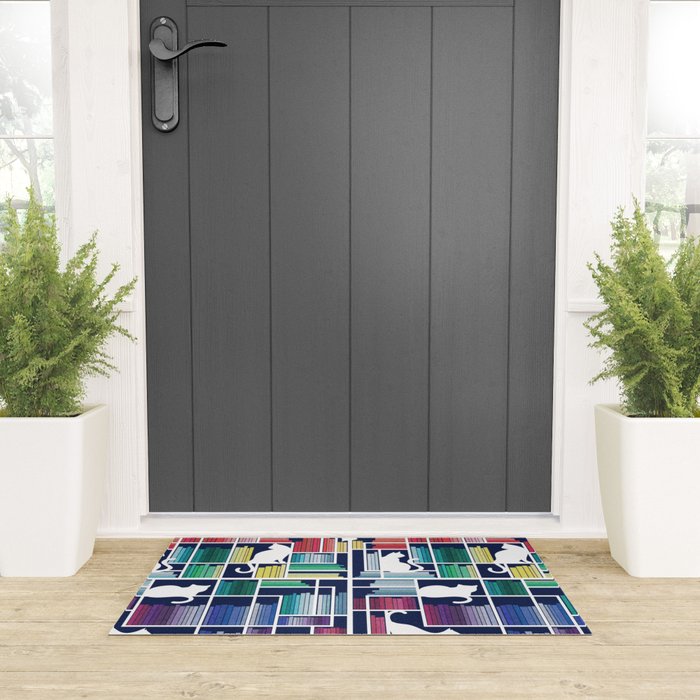 Rainbow bookshelf // navy blue background white shelf and library cats Welcome Mat Gallery Image 3