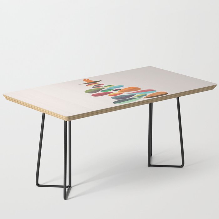 Bird nesting on top of pebbles hill Coffee Table Gallery Image 1