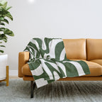 Retro Modern Liquid Swirl Abstract Pattern in Deep Green and White Throw Blanket Gallery Image 1