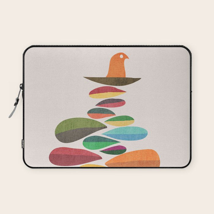 Bird nesting on top of pebbles hill Laptop Sleeve Gallery Image 1
