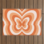 Retro 70s Butterfly in Sunset Orange Outdoor Rug Gallery Image 1