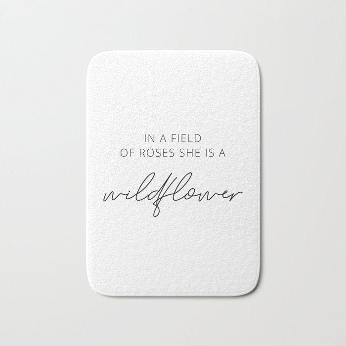 In a field of roses she is a wildflower Bath Mat Gallery Image 1