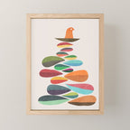 Bird nesting on top of pebbles hill Mini Art Print Gallery Image 1