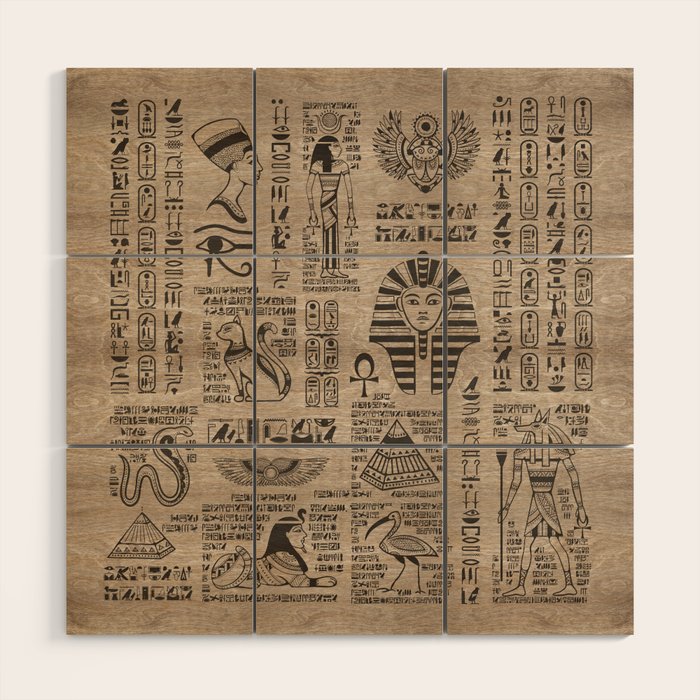 Egyptian hieroglyphs and symbols on wood Wood Wall Art Gallery Image 1