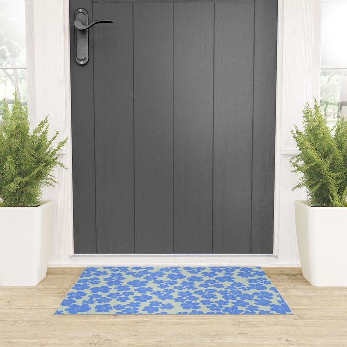 Blue flower blossom scatter on soft green Welcome Mat Gallery Image 3