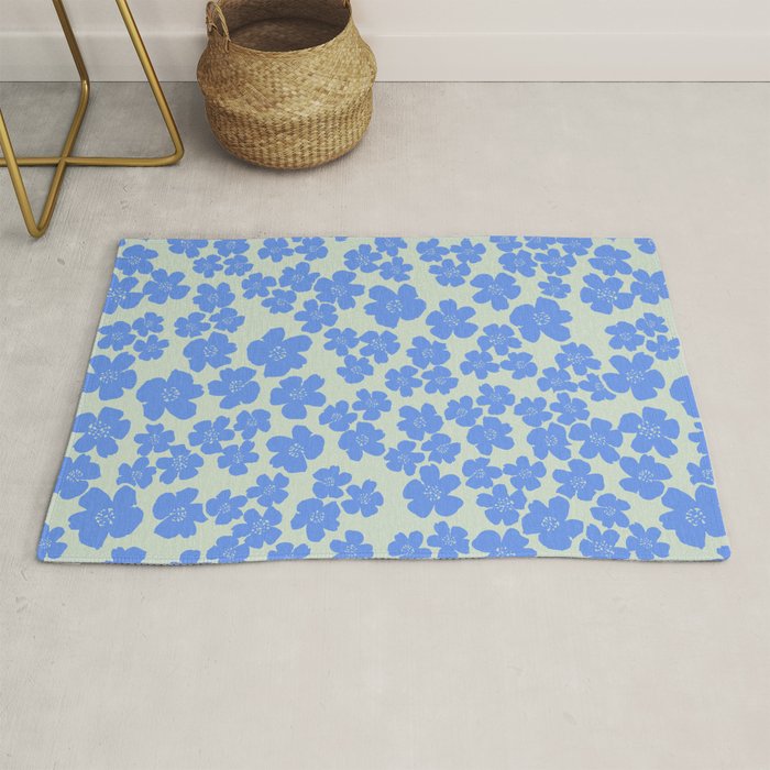 Blue flower blossom scatter on soft green Rug Gallery Image 1