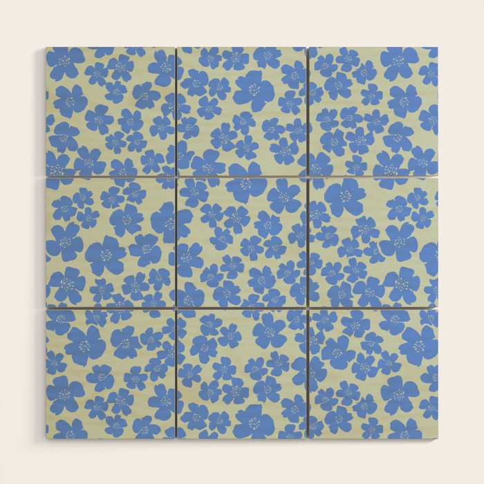 Blue flower blossom scatter on soft green Wood Wall Art Gallery Image 1